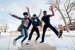 Cole students jumping in the snow during winter break