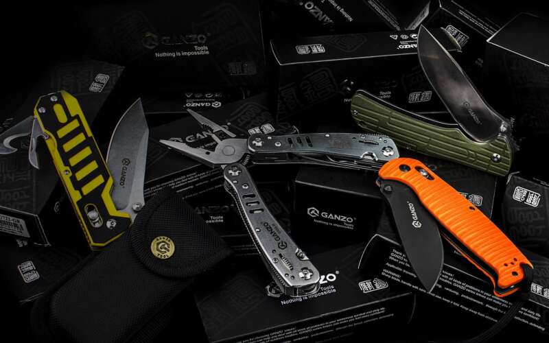 two pocket knives and a stainless steel multitool