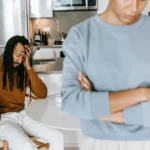 Two roommates arguing in their kitchen