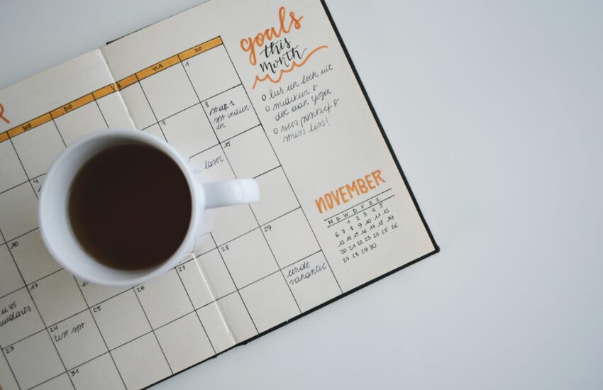 Coffee mug sitting on a planner
